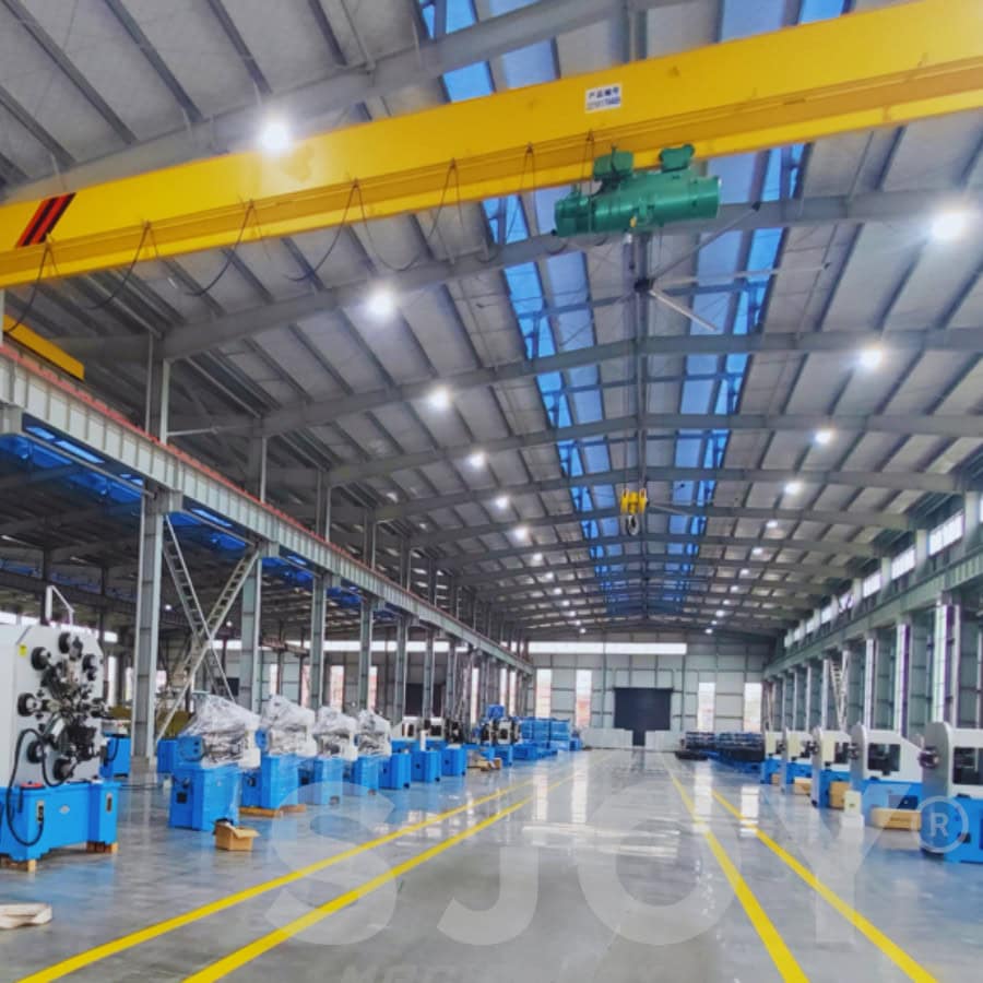 Sjoy spring machine workshop with advanced equipment, focused on precision manufacturing of CNC spring and wire forming machines for various industrial applications.